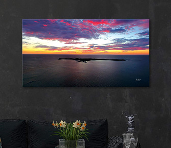 Flaming Skies over Penguin Island, Shoalwater Islands Marine Park is a stunning dramatic aerial photograph of Rockingham's beautiful coastline available in a selection of canvas sizes.